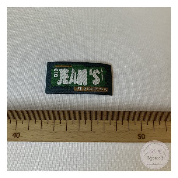 Puha farmerkék alapon zöld, rajta fehér betűk, 6,5x3 cm (FVF9)